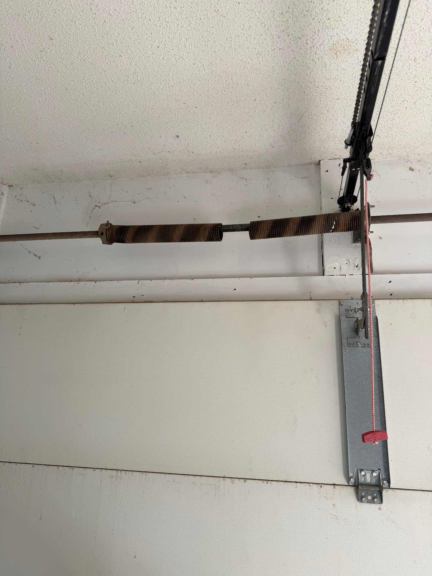 Broken garage door torsion spring